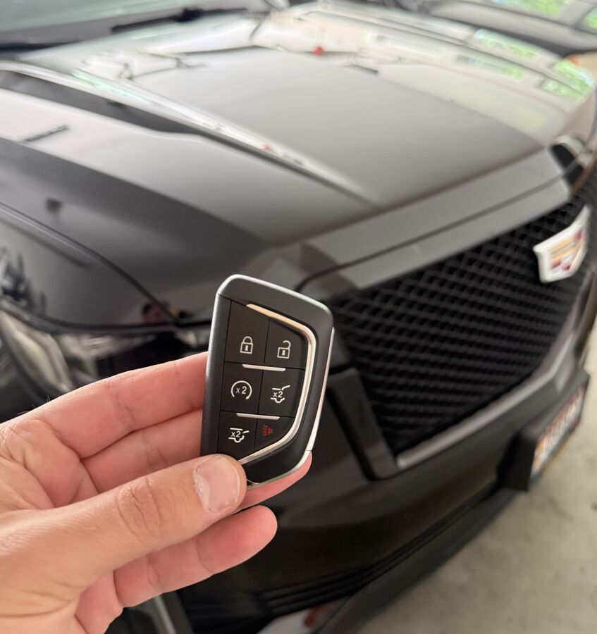Cadillac Escalade smart key fob programmed on site by a mobile locksmith in Spokane, WA